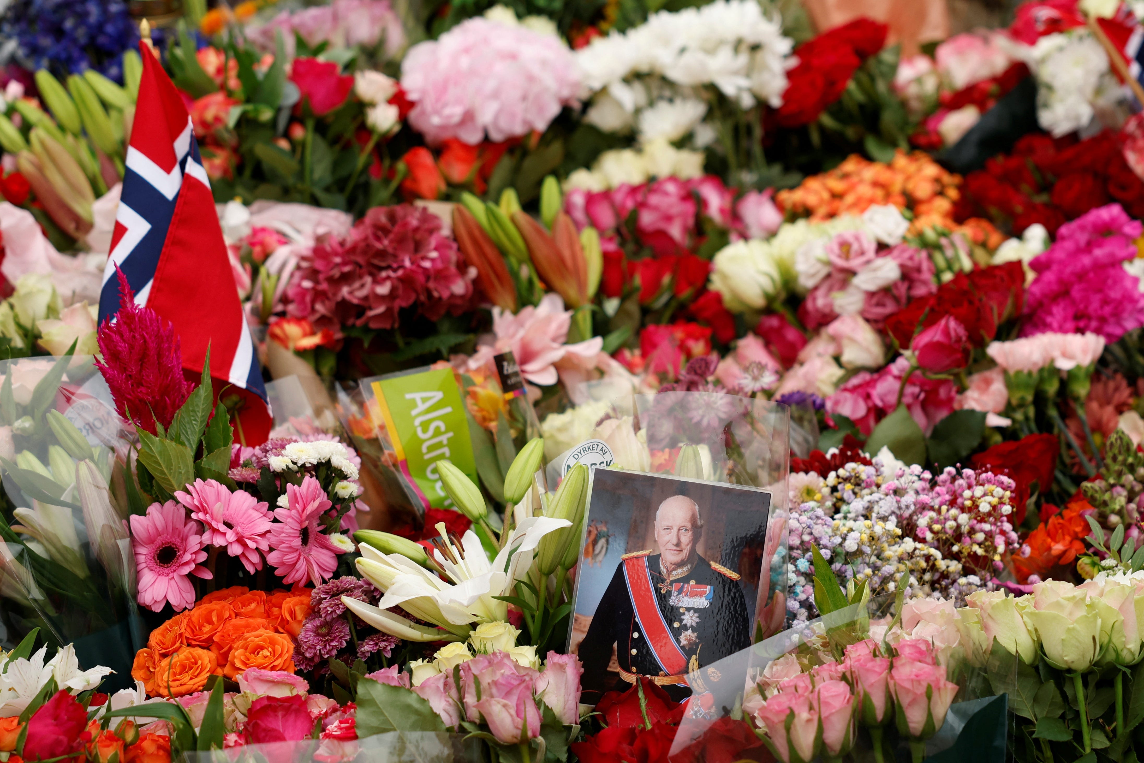 Norwegians Gather Outside the Royal Palace in Oslo to Mourn King Harald V